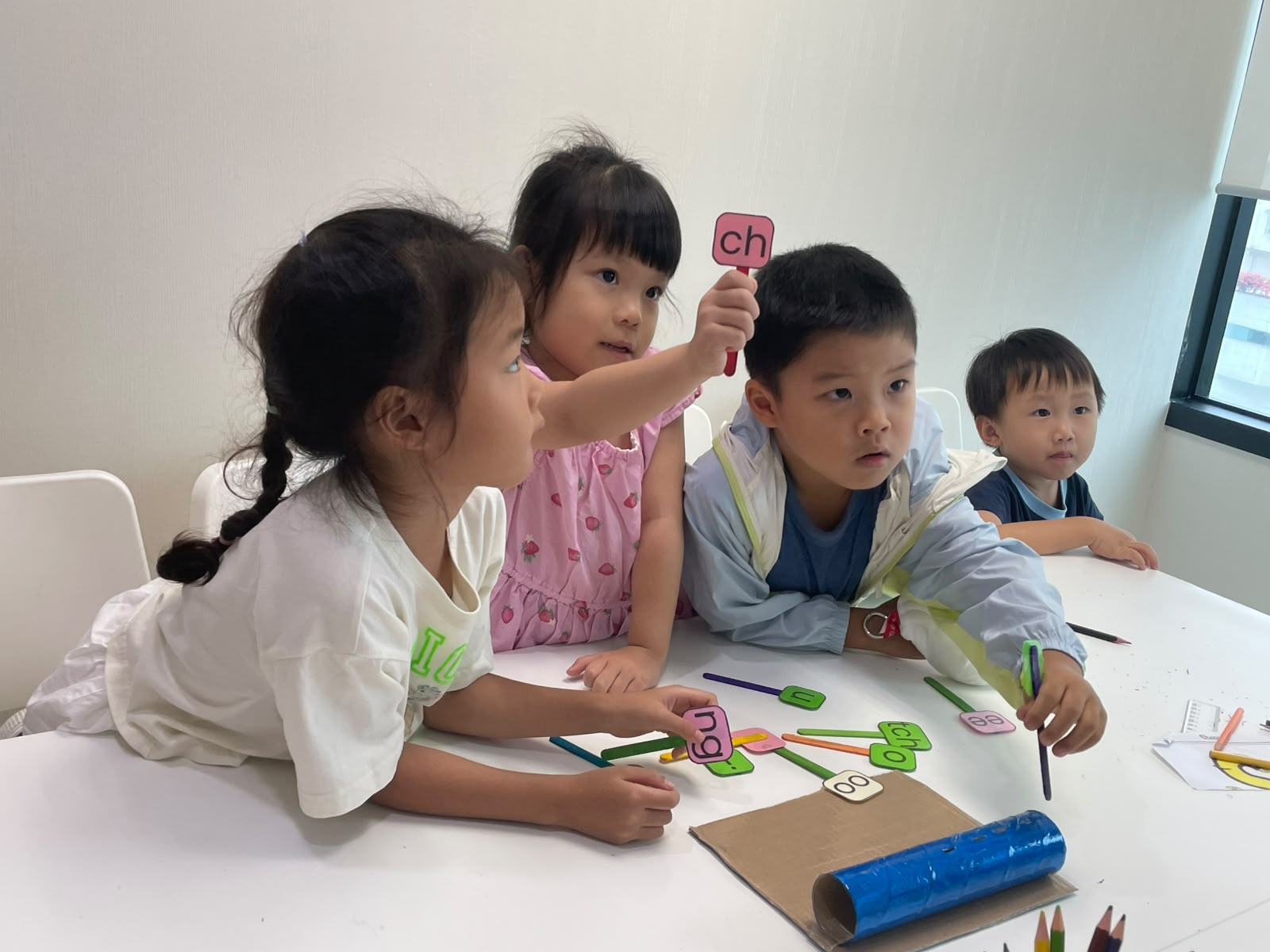 Children taking part in a grapheme-card activity at Euphoria